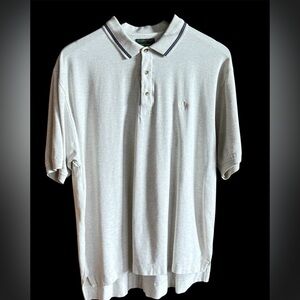 Men's Dockers Golf large short sleeve polo with blue stitching on the collar.